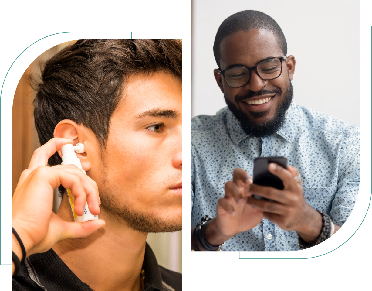 A man inserts a wireless earbud while another man, wearing glasses, smiles at his smartphone.